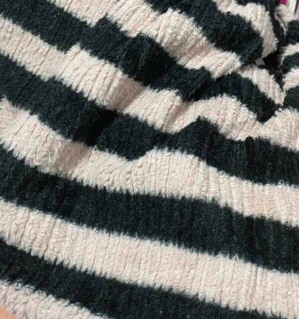 Jumper in a soft rib knit containing some wool. Relaxed fit with a high collar